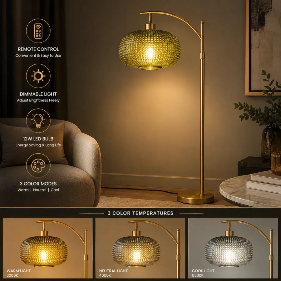 A modern floor lamp with a curved brass arm and a textured glass shade glowing with warm light, shown in a styled living room setting. The left side includes feature callouts: remote control, dimmable light, 12W LED bulb, and 3 color modes.