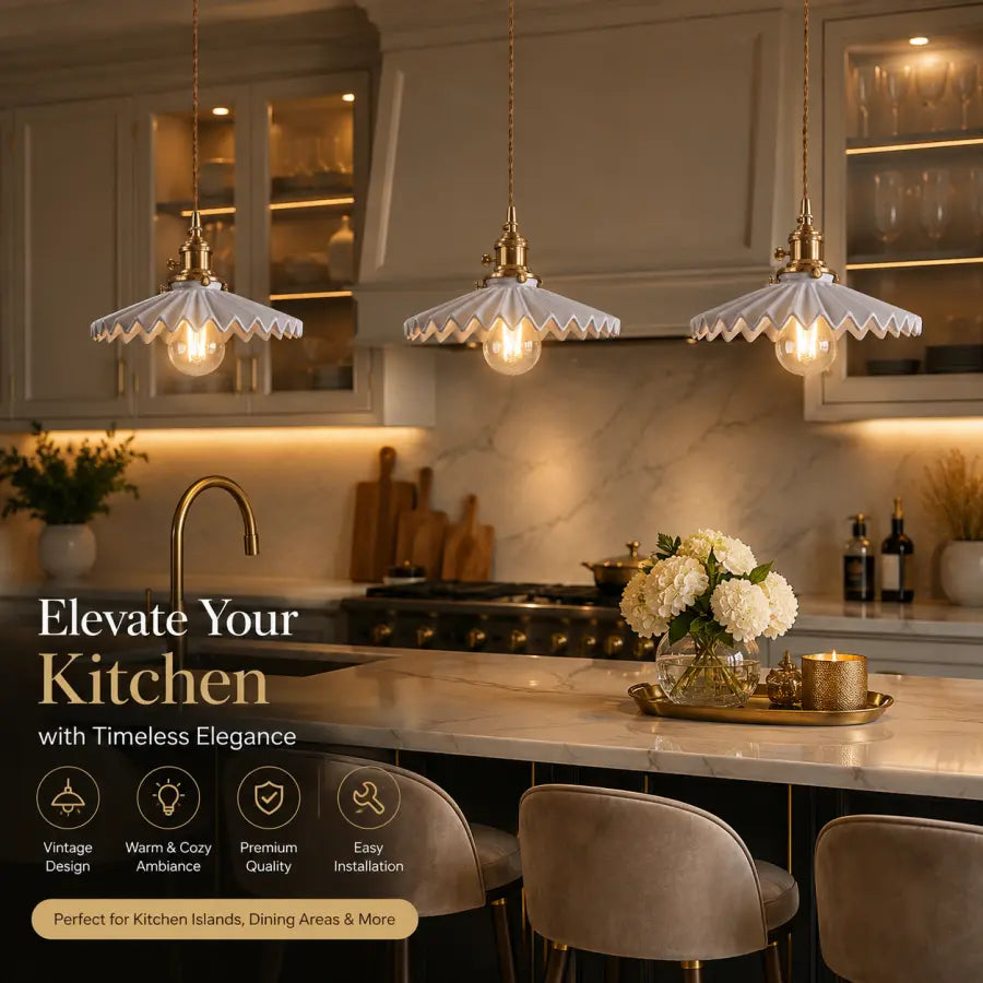 Three vintage-style pendant lights with scalloped white glass shades and warm brass hardware hang over a modern kitchen island. The scene includes marble countertops, dark cabinetry, a marble backsplash, and decorative flowers on a tray, with promotional text overlaid on the left side.