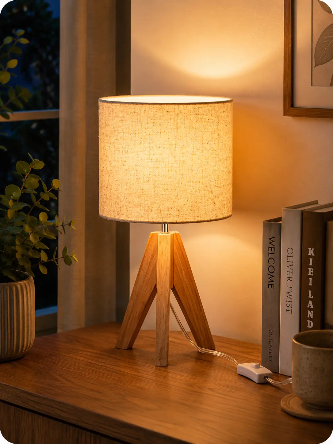 Modern wooden tripod table lamp with linen fabric shade on a bedside table, perfect for bedroom, living room and cozy home lighting